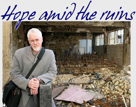 Photo by Linda Panetta, Bruce amid the ruins in Iraq