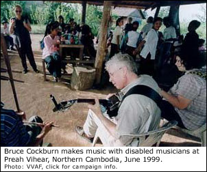 Bruce plays with disabled musicians in Cambodia, 1999.