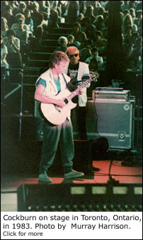 Cockburn on stage in 1983. Photo by Murray Harrison